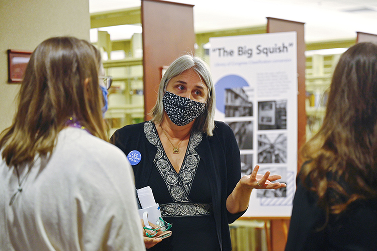 Susan Martin, chair of collection development and management for the James E. Walker Library, explains to MTSU students how the transition from the Dewey Decimal System of classification to the Library of Congress system will make finding library resources easier for them. (MTSU photo by Cat Curtis Murphy)