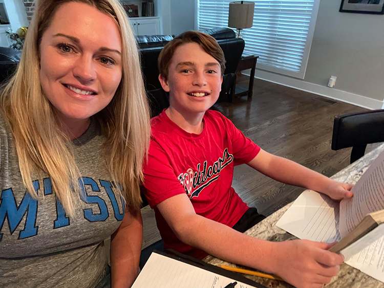MTSU senior Melissa Rogers, left, of Murfreesboro, Tenn., and her son Eli, 10, study together at home in this undated photo. Rogers, 35, returned to the classroom after more than a decade and now the trucking company executive is set to earn her bachelor’s degree through MTSU’s University College in December. (Submitted photo)