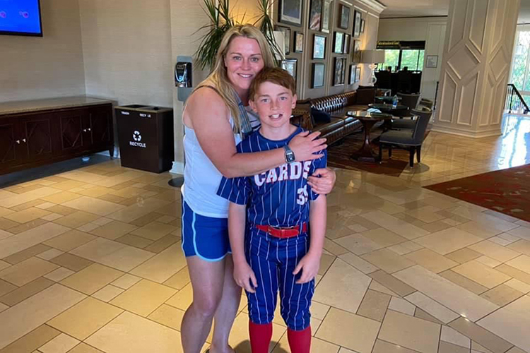 MTSU senior Melissa Rogers, left, of Murfreesboro, Tenn., and her son Eli pose for a photo before the St. Louis Cardinals’ World Series Game 7 win over the Texas Rangers in 2011. A trucking company executive, the working mother returned to the classroom after more than a decade and is set to graduate in December with a bachelor’s degree in integrated studies. (Submitted photo)