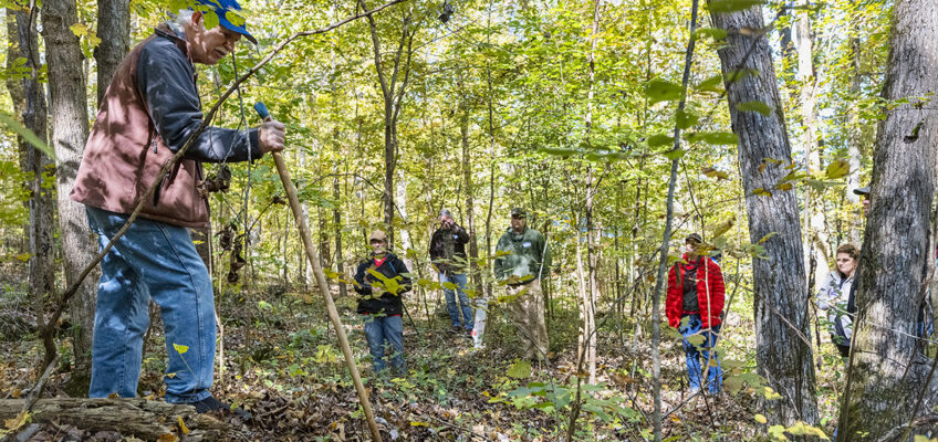Bob Beyfuss, left, a retired New York State ginseng specialist for the Cornell University Cooperative Extension, shows attendees tips about planting ginseng on a hillside at the 2021 Tennessee Ginseng Growers Workshop at the Barfield Crescent Park Wilderness Station in Murfreesboro, Tenn. The International Ginseng Institute at MTSU will host a Ginseng Workshop and Demo Day on Friday, Oct. 21, at the park. (MTSU file photo by Andy Heidt)