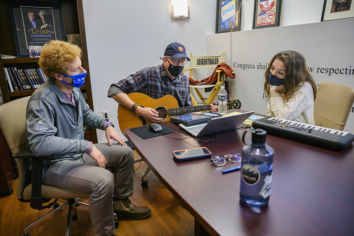 Veteran Tim Gassman, left, an MTSU accounting graduate student from Murfreesboro, listens as Byron Hill of the Nashville Songwriters Hall of Fame and MTSU student songwriter Sophia McCarthy, a senior from Lafayette, Louisiana, work on their song, “When You Get Home,” during the 2021 Operation Song retreat Oct. 29 at the university. The event teams trios of military veterans, student and professional songwriters to create healing music for the veterans and training for the students. (MTSU photo by Andy Heidt)