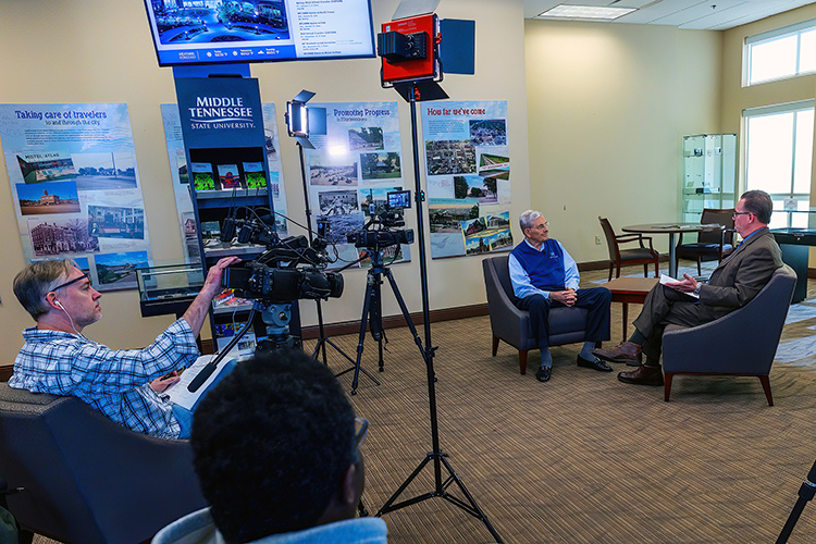 MTSU alumnus and director John Hood discusses his life, career and legacy on the final CityTV “Storytellers” program in the MTSU Room at the Rutherford County Chamber of Commerce after serving as host for 10 years. At far right interviewing Hood is Mike Browning, Murfreesboro PIO and also an alumnus. (City of Murfreesboro photo)