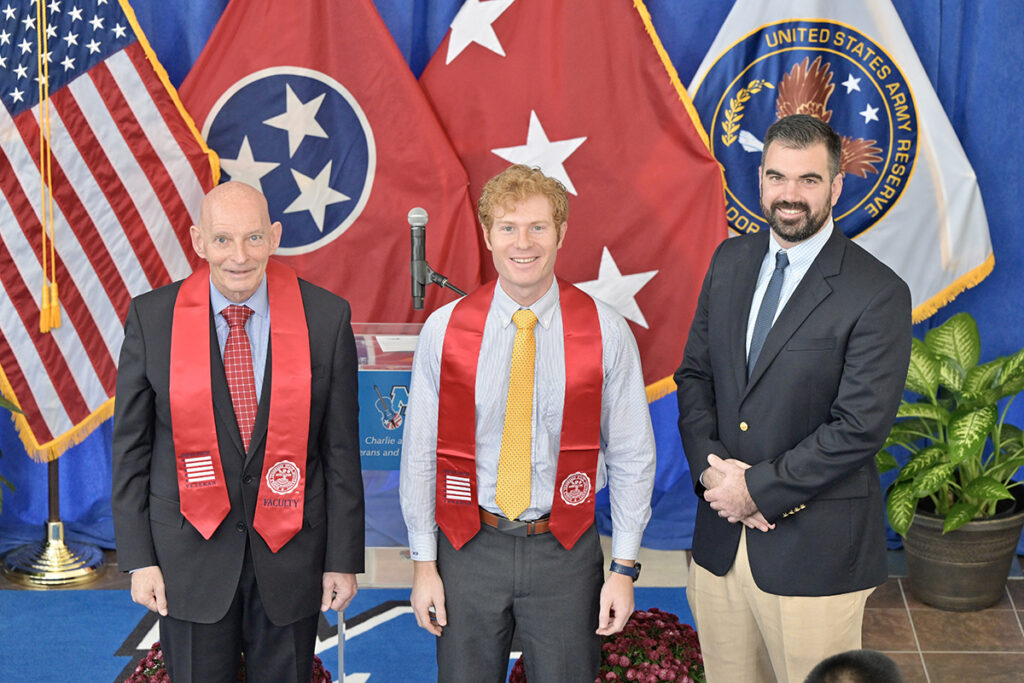 MTSU’s Keith M. Huber, left, graduating veteran Timothy Gassman and guest speaker Scott Lamb are shown during the fall 2021 MTSU Graduating Veterans Stole Ceremony Wednesday, Dec. 1, in the Miller Education Center second-floor atrium. Thirty student veterans, who will be graduating from MTSU on Saturday, Dec. 11, received red stoles to wear during commencement. Huber is senior adviser for veterans and leadership initiatives and a retired U.S. Army lieutenant general. Lamb, a U.S. Navy veteran, is senior program manager for Amazon in Nashville, Tenn. (MTSU photo by Andy Heidt)