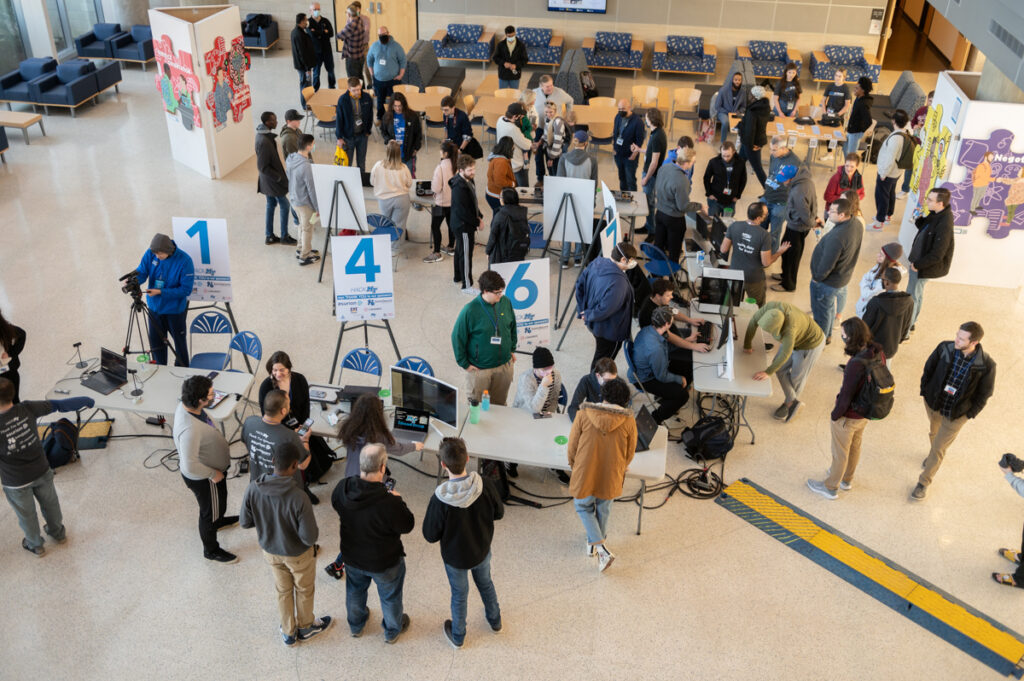Students, faculty, mentors, sponsors and visitors gather Sunday, Jan. 30, for the seventh annual HackMT finale event, held in the MTSU Science Building Liz and Creighton Rhea Atrium. About 60 students on seven teams competed in the 36-hour, in-person event to create apps and other technology-driven projects. (MTSU photo by James Cessna)