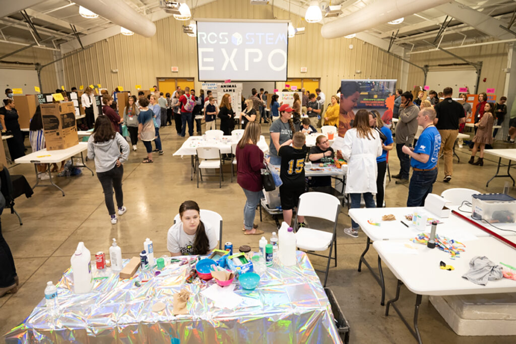 Rutherford County Schools' middle and high school students, teachers and family members mill about the Lane Agri-Park March 22 for the RCS STEM Expo. MTSU provided a $1,000 scholarship, other swag, judging and mentoring for the fourth annual event. (MTSU photo by James Cessna)