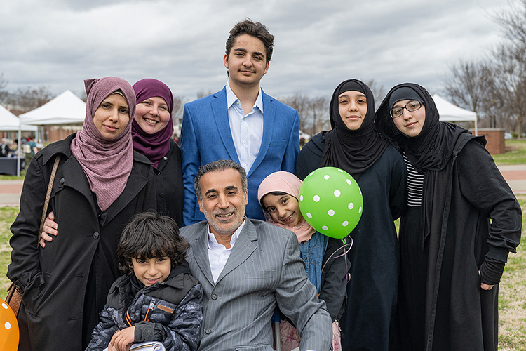 The Alnassari family was instrumental in organizing the Festival of Veils, a March 19 event that revealed the history of veils in various religions, on the Student Union Commons. Pictured, from left, in rear, are Salwi Al-Rubaye; MTSU student and chief organizer Khadijah Alnassari; and Khadijah's triplets Ahmad, Zaynab, and Fatimah Alnassari, all of whom volunteered at the event. Al-Rubaye is the triplets' stepmother. In front, from left, are 5-year-old Muhammad Ali Alnassari; Akeel Alnassari, the triplets’ father; and 8-year-old Zahrah Alnassari. (MTSU photo by Cat Curtis Murphy)