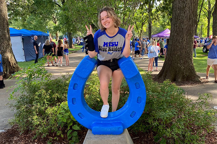 MTSU senior psychology major Haley Burt, a Murfreesboro, Tennessee, native, poses for a photo at the Blue Horseshoe in Walnut Grove in this undated photo. Burt, who’s minoring in criminal justice administration, is one semester away from graduating and already working her dream job at just 20 years old. She credits the university’s Dual Enrollment program with jump-starting her academic career. (Submitted photo)