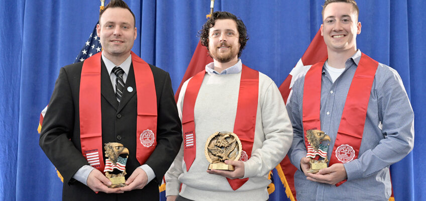 Jon Higgins, left, Jon Allen and Michael Maynard of Pleasant View, Tenn., show awards they received Wednesday, April 27, during the Graduating Veterans Stole Ceremony in the Miller Education Center on Bell Street. Higgins and Maynard were named co-winners of the Daniels Veterans Center Leadership Award. Allen received the Daniels Center/Journey Award. (MTSU photo by Andy Heidt)