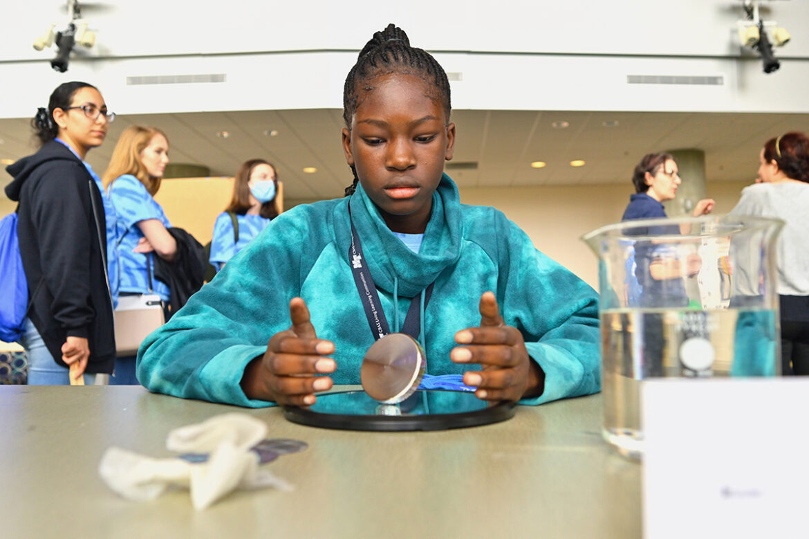 Lexi Tut performs a physics experiment in a “Physics Phun” workshop as part of the 25th annual Tennessee Girls in STEM Conference at MTSU in the Science Building in early April. About 100 middle school and 75 high school girls participated in the event that was all about science, technology, engineering and math. The 26th conference this fall will be held Saturday, Sept. 24, on campus. (MTSU photo by Cat Curtis Murphy)