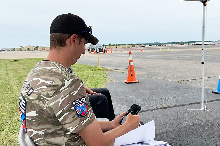 Lt. Andrew Bennett of the Middle Tennessee State University Police Department times an MTSU officer completing a driving obstacle course as part of the department’s annual Emergency Vehicle Operations Course training at the Smyrna Airport in Smyrna, Tenn., on June 10, 2022. (Photo courtesy of MTSU Police)