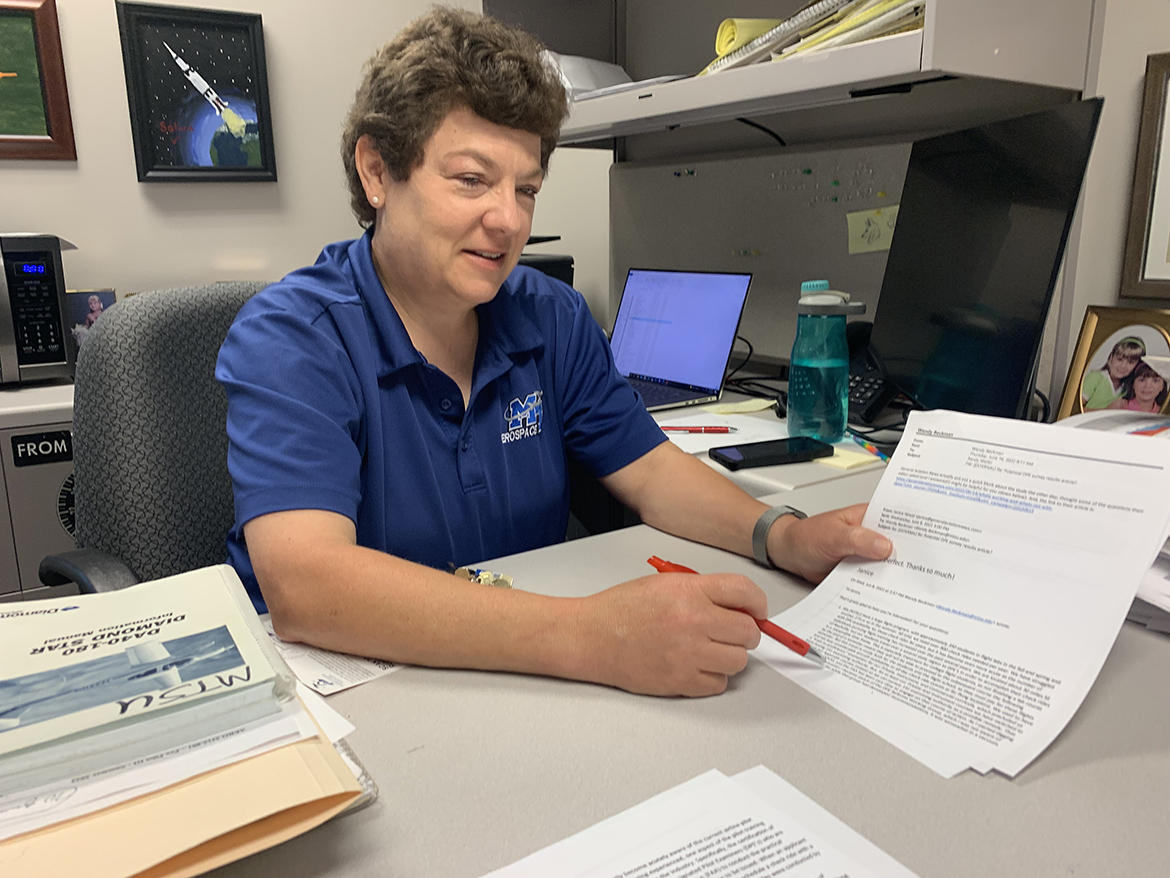MTSU professor Wendy Beckman reviews an email response she received related to the study the Aerospace Department conducted earlier this year. The investigation involved the pilot examiner shortage and how it impacts not only MTSU students scheduling check rides with examiners, but also students at flight schools nationwide. (MTSU photo by Randy Weiler)