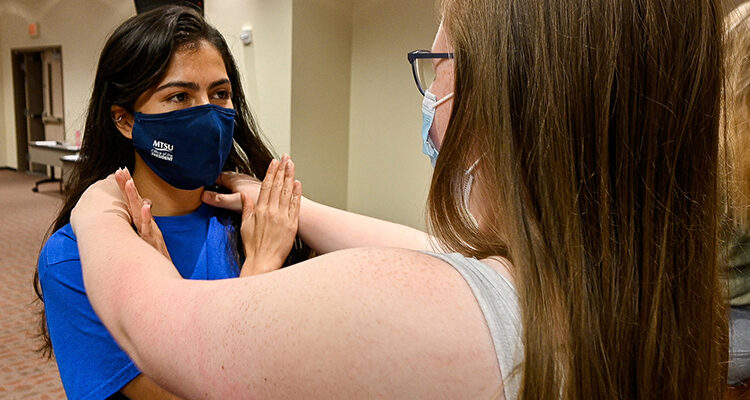 In this September 2021 file photo, Middle Tennessee State University student Gaby Jaimes, left, practices defending against an attack from her partner Savannah Winegar, another MTSU student, as part of the free self-defense course Rape Aggression Defense Systems, or RAD. Registration is open for the next RAD course that begins July 5, 2022. (MTSU file photo by Stephanie Barrette)