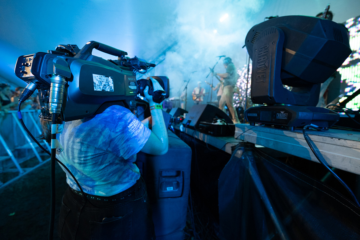 An MTSU College of Media and Entertainment student films a performance early Sunday, June 19, at the Bonnaroo Music and Arts Festival in Manchester, Tenn., one of 21 performances captured by students in the Media Arts and Recording Industry departments during the four-day festival. (MTSU photo by James Cessna)