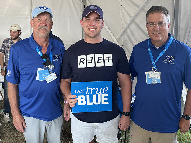 MTSU Provost Mark Byrnes, right, and Aerospace associate professor Terry Dorris, left, spent time with aerospace alumni during the weeklong EAA AirVenture held in Oshkosh, Wis. (MTSU photo by Andrew Oppmann)