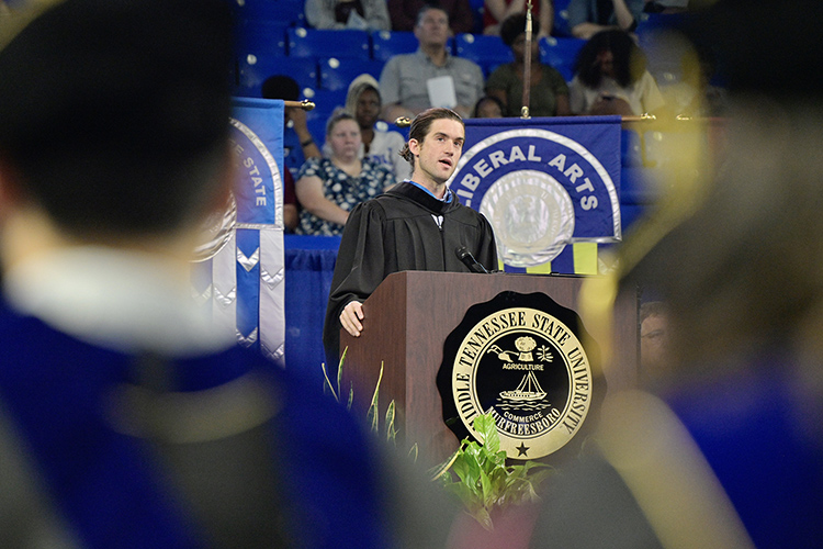 Andrew Forsthoefel, author of "Walking to Listen," delivers the main address Sunday, Aug. 21, at the 2022 University Convocation at Murphy Center. (MTSU photo by Andy Heidt)