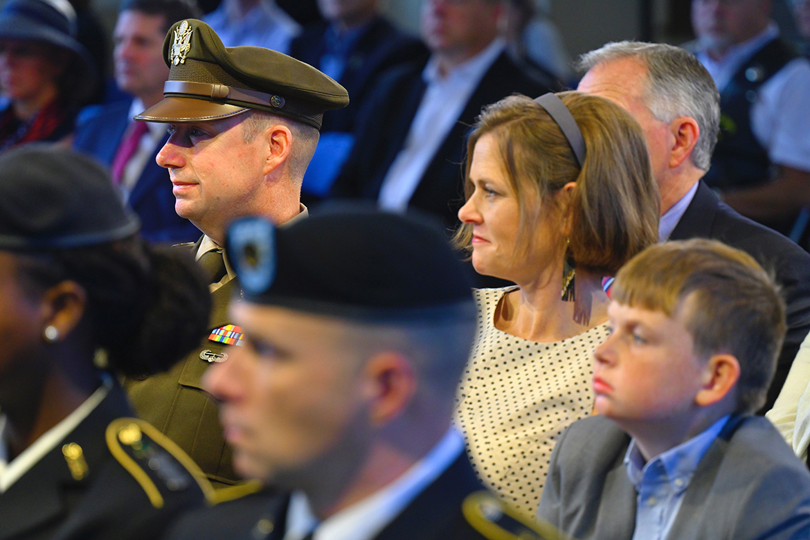 The crowd attending the eighth annual 9/11 Remembrance at MTSU listens as guest speaker Greg Mays shares a personal experience from the events that happened Sept. 11, 2001, and in the days that followed. Among those attending the early-morning ceremony were U.S. Army Lt. Col. Arlin Wilsher, left, the professor of military science in the MTSU ROTC program, his wife, Lori, and their son, Bradley. (MTSU photo by Cat Curtis Murphy)