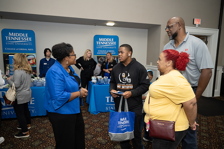 Leah Lyons, left, dean of the College of Liberal Arts at Middle Tennessee State University, shares about the college’s programs to a prospective student and his family at the Wednesday, Oct. 5, 2022, True Blue Tour event at the Millennium Maxwell House in Nashville, Tenn. (MTSU photo by James Cessna)