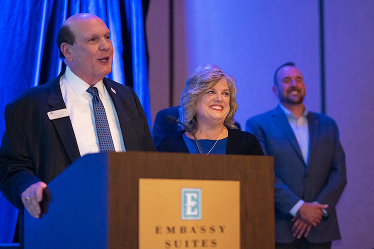 David Urban, left, dean of the Jennings A. Jones College of Business at Middle Tennessee State University, prepares to present alumna Lori Williams, right, with the Jones College Exemplar Award during a special reception for 2022 Leadership Summit award recipients hosted by the college on Oct. 27, 2022, at Embassy Suites in Murfreesboro, Tenn. (MTSU photo by Cat Curtis Murphy)