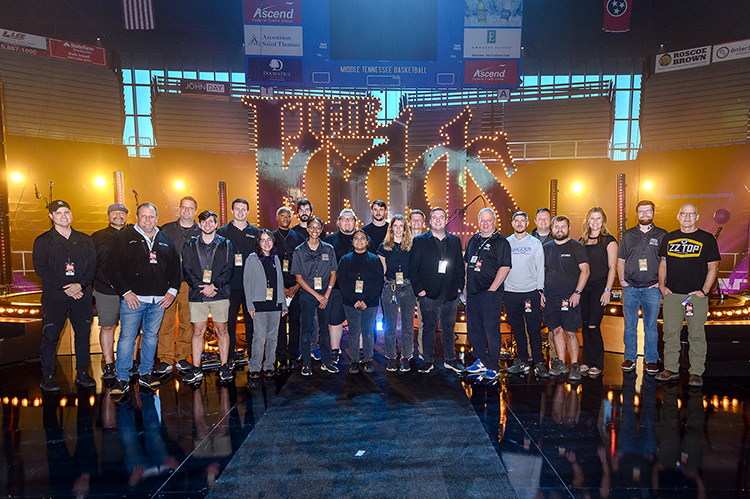 Middle Tennessee State University Deparment of Media Arts students, faculty and alumni pose for a photo on the red carpet of “The Judds: Love is Alive – The Final Concert” event, which they helped work on the broadcast and production of, on Thursday, Nov. 3, 2022, at the Murphy Center on campus. MTSU media arts professor Bob Gordon, who produced the red-carpet broadcast, is shown seventh from right. (MTSU photo by James Cessna and Cat Curtis Murphy)