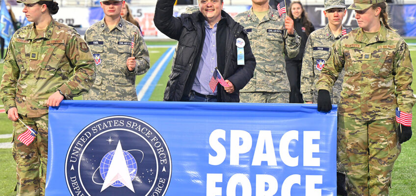 MTSU adjunct songwriting professor and Air Force veteran Jamie Teachenor, center, waves to the crowd Saturday, Nov. 12, as he represents the Space Force as part of MTSU’s 40th annual Salute to Armed Forces and Veterans football event at Floyd Stadium. He is joined by accompanied by MTSU Air Force ROTC cadets and cadets from the Smyrna squadron of Civil Air Patrol, the Air Force’s civilian auxiliary. Teachenor wrote the new Space Force anthem, “Sempre Supra,” which was played by MTSU’s Band of Blue for what is believed to be the first time by a marching band. (MTSU photo by Cat Curtis Murphy)