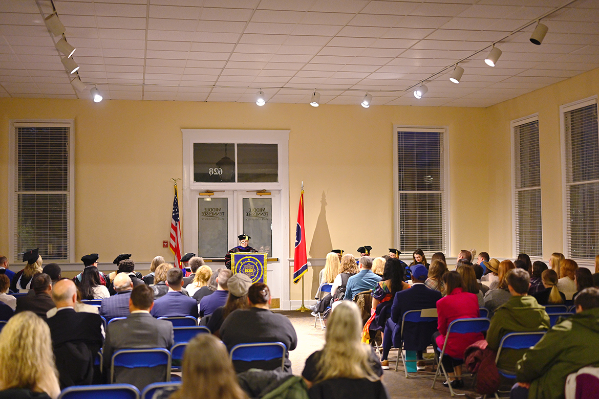 Audience members attending The Honor Society of Phi Kappa Phi at Middle Tennessee State University listen to Dr. Meredith Dye, associate dean in the College of Liberal Arts, offer a challenge during the fall 2022 initiation ceremony in the Tom H. Jackson Building’s Cantrell Hall. The formal ceremony included the initiation of more than 70 combined students and faculty. (MTSU photo by Cat Curtis Murphy)
