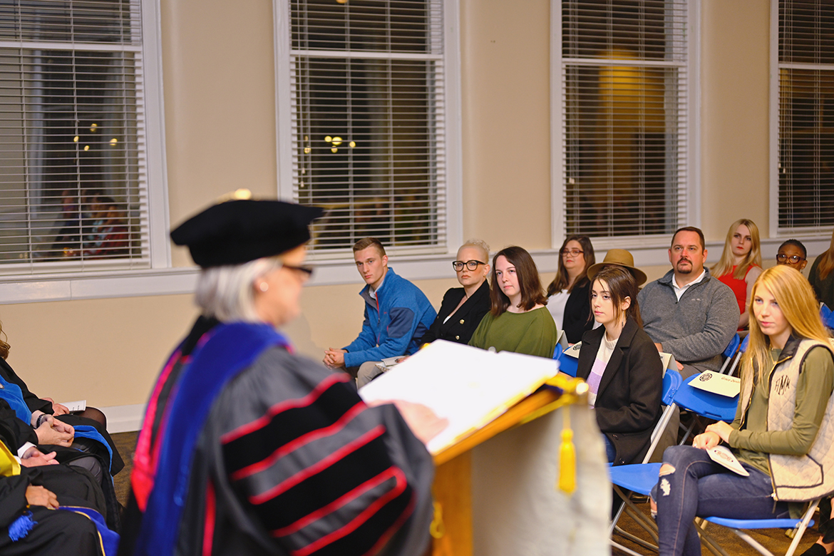 Middle Tennessee State University students, faculty and staff and guests listen as Meredith Dye, associate dean in the College of Liberal Arts, provides direction in their continued pursuit of academic success in higher education during the fall 2022 initiation ceremony in the Tom H. Jackson Building’s Cantrell Hall. Dye’s message to the initiates came from the motto that is the foundation and heart of Phi Kappa Phi: “Let the love of learning rule humanity.” (MTSU photo by Cat Curtis Murphy)