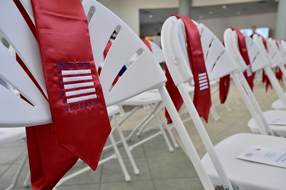 MTSU fall Stole Ceremony5.jpg Red stoles and event programs adorn the chairs set up for Middle Tennessee State University senior student veterans Wednesday, Nov. 30, at the Graduating Veterans Stole Ceremony in the Andrew Woodfin Miller Sr. Education Center second-floor atrium on Bell Street. More than 40 senior student veterans attended the event. In all, 56 will be among those graduating Saturday, Dec. 10, during commencement in Murphy Center. (MTSU photo by Andy Heidt)