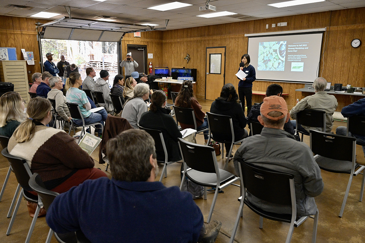The audience attending the fall MTSU Ginseng Workshop and Demo Day at Barfield Crescent Park's Wilderness Station in Murfreesboro, Tenn., listens as Iris Gao, director of the International Ginseng Institute, provides opening remarks and welcomes them to the event. More than 40 people attended the event. (MTSU photo by Andy Heidt)