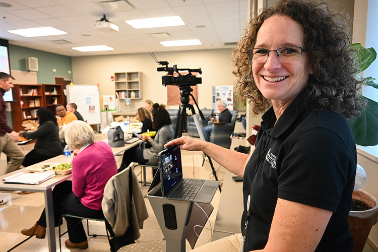 Lisa Strayer, executive aide at Middle Tennessee State University’s Center for Fairness, Justice and Equity, monitors the Zoom for the center’s lunch-and-learn about neurodiversity in the classroom on Nov. 30, 2022, at the College of Education building on campus. (MTSU photo by Stephanie Wagner)
