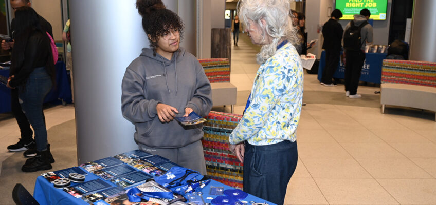 Middle Tennessee State University Recording Industry professor Amy Macy, right, shows music business options to Mia Bush, 17, a La Vergne High School senior performing dual enrollment with Motlow State Community College in January 2023 during the kickoff to last year’s MTSU Promise Tour to recruit transfer and future students to the university. Dozens of Motlow students attended the three-hour visit by MTSU faculty and staff. MTSU returns to Motlow in Smyrna Tuesday, Jan. 30, for the start of the 2024 tour. (MTSU file photo by James Cessna)