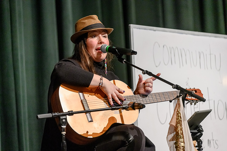 Tennessee Performing Arts Center visiting artist/educator Alison Brazil sings one of her original songs in three languages to Siegel Humanities Academy students Jan. 25 during Humanities Week at Siegel High School in Murfreesboro, Tenn. The academy is a partnership between Siegel and Middle Tennessee State University’s College of Liberal Arts. (MTSU photo by J. Intintoli)