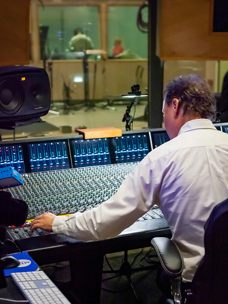 MTSU Recording Industry Chair John Merchant works the sound board at a special recording session Saturday, Feb. 18, 2023, for Nashville gospel artist Brenda Ivey Robertson in the studios at Middle Tennessee State University in Murfreesboro, Tenn. (MTSU photo by Tom Beckwith)