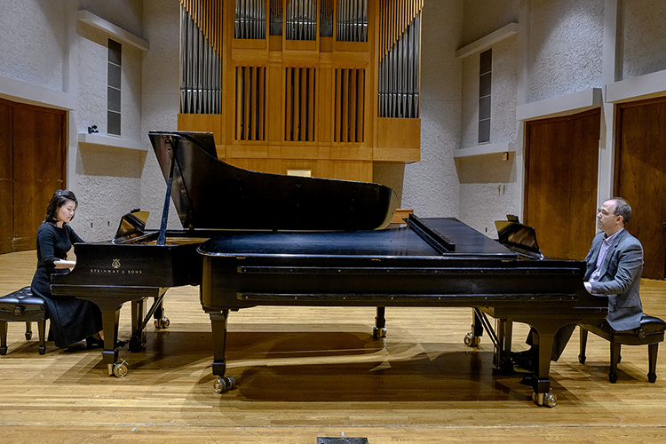MTSU School of Music professors Eunbyol Ko, left, and Adam Clark, right, prepare to rehearse a piece for four hands on two Steinway concert grand pianos in Hinton Hall on campus for the "Steinway Anniversary Celebration Concert" on Tuesday, April 4. The free public concert, planned for 7:30 p.m., will feature a “piano extravaganza” of performances by MTSU students, faculty and alumni to showcase both their talent and the unmistakable tones of the Steinway. MTSU, which has 60 grand and upright Steinways, is marking its 20th anniversary as one of 200-plus "All-Steinway Schools" in the world and the first designated as such in Tennessee. (MTSU photo by J. Intintoli)