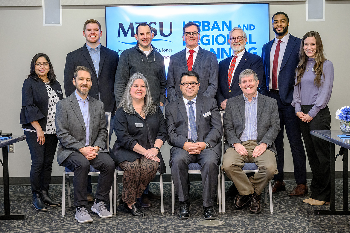 Members of the advisory committee for the Jennings and Rebecca Jones Chair of Excellence in Urban and Regional Planning gather for a group photo during their February meeting at the MTSU Student Union. Shown standing, from left, are Rubi Devi, research association, Business and Economic Research Center, or BERC; Ryan Egly, Lawrence County Chamber of Commerce; Kendrick Curtis, Middle Tennessee Industrial Development Association; Cliff Lippard, Tennessee Advisory Commission on Intergovernmental Relations; committee chair and alumnus Paul Martin Jr., Clarity Resources LLC; Joseph Howard, BERC student researcher; and Andrea Lawrence, BERC secretary. Seated, from left, is Patrick Cammack, Rutherford County Chamber of Commerce; Lori Odom, Nashville Area Chamber of Commerce; Murat Arik, chairholder and BERC director; and Steven Livingston, BERC associate director and political science professor. (MTSU photo by J. Intintoli)
