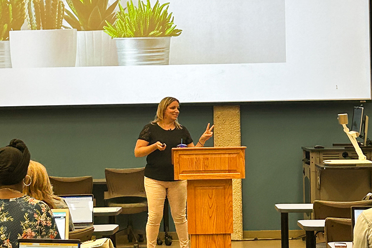 Emily Gill, center, Middle Tennessee State University alumna and school counselor for Thurman Francis Arts Academy in Smyrna, Tennessee, was recently named the Tennessee School Counselor of the Year by the Tennessee School Counselor Association. She recently presented at her alma mater as part of the Center for Educational Media's School Counselor Collaborative professional development on Thursday, July 13, at the Ned McWherter Learning Resources Center on campus. (MTSU photo by Tiffany Wilson)
