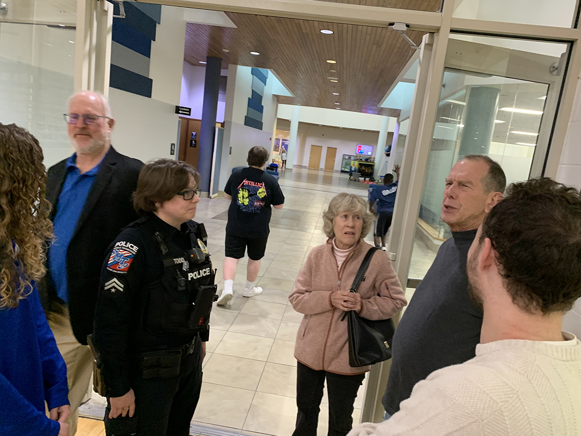 Middle Tennessee State University Master Police Officer Amanda Todd, third from left, listens as Richard Detmer, second from right, discusses his Jan. 19 cardiac arrest while playing racquetball and how thankful he is that four Campus Recreation Center student workers and Campus Police helped save his life. Also pictured, from left, are student Julia Rutledge, Campus Rec Director Charlie Gregory, Carol Detmer and student Gatlin Murr. Detmer, a retired professor and Computer Science Department chair, has quickly recovered. He and his wife delivered cookies Feb. 9 to thank those who helped save his life. (MTSU photo by Randy Weiler)