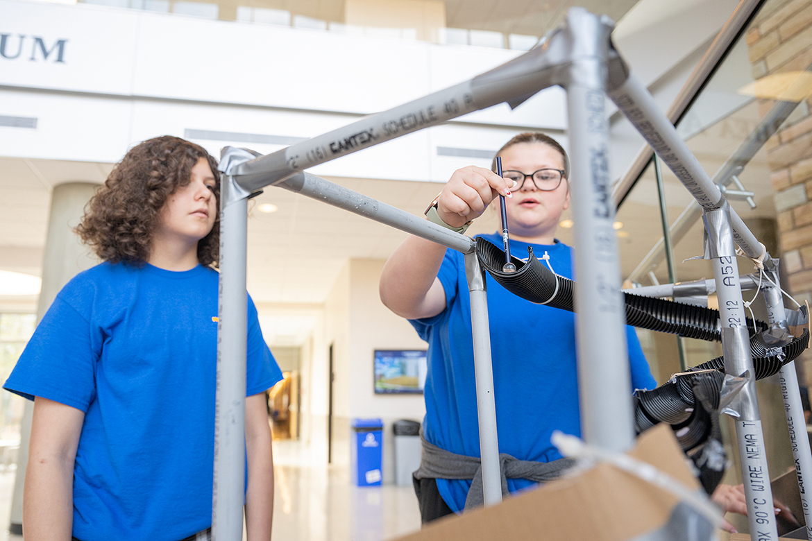 Middle school students use a marble as they begin to compete in the Roller Coaster event during the Regional Science Olympiad Saturday, Feb. 17, in the Middle Tennessee State University Science Building. About 300 combined middle school and high school students, 70 volunteers and 50 teachers and parents attended the event. (MTSU photo by Cat Curtis Murphy)