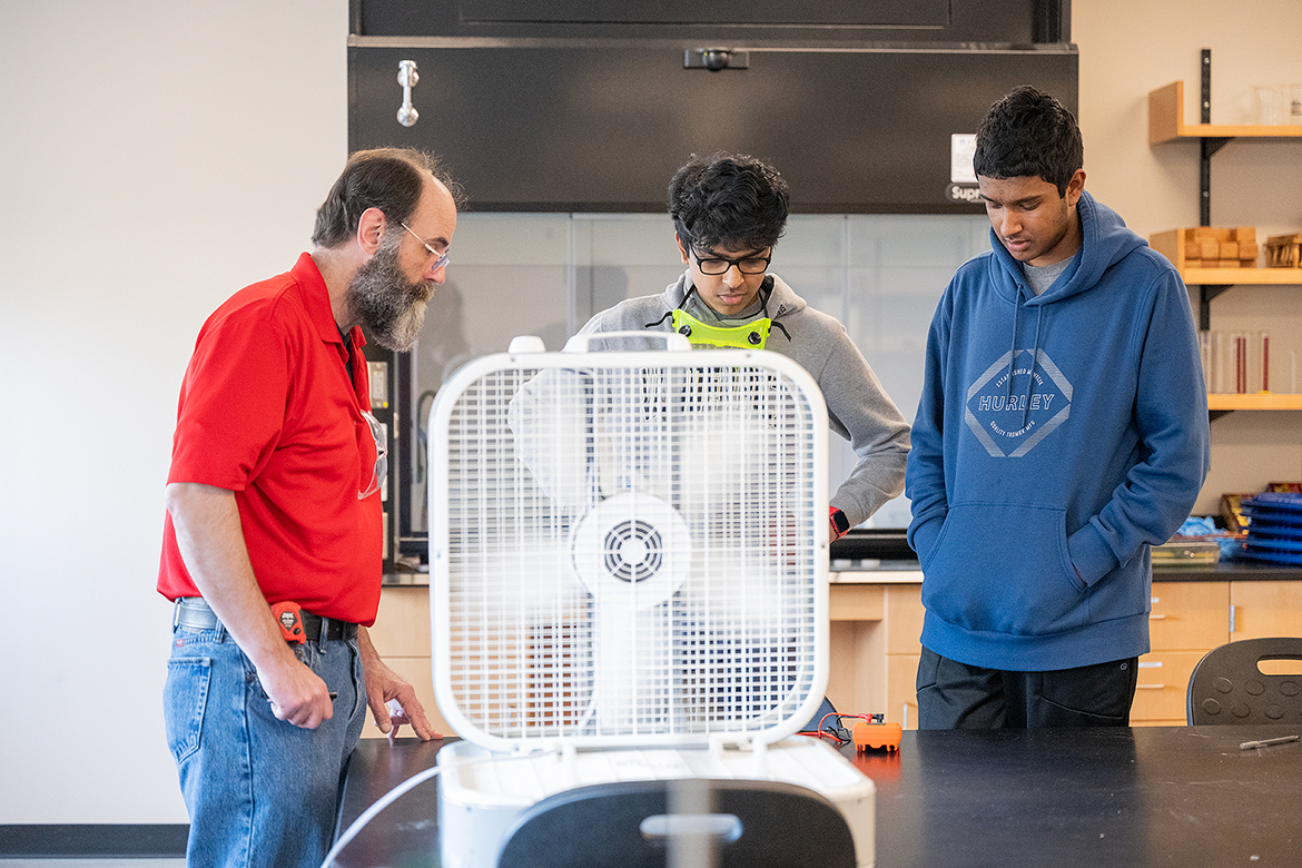 A volunteer from Nissan, left, oversees a wind-aided project conducted by two students competing in the annual Regional Science Olympiad Saturday, Feb. 17, in the Middle Tennessee State University Science Building. There were 300 middle school and high school students vying for team berths in April’s State Science Olympiad. (MTSU photo by Cat Curtis Murphy)