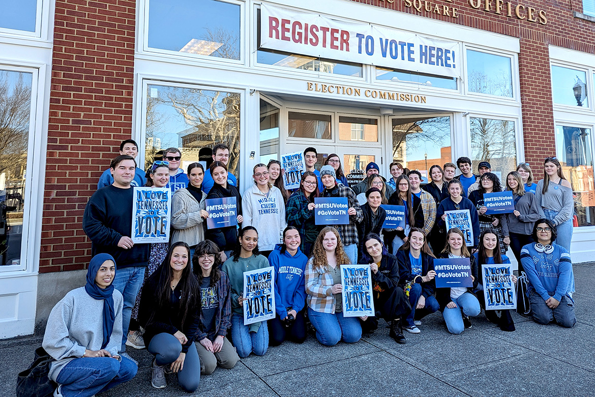 Middle Tennessee State University students participating in the 2024 Buchanan Honors Lecture Series along with members of the university’s American Democracy Project chapter take a group photo Feb. 19, 2024, outside the Rutherford County Election Commission Office on the court square in Murfreesboro, Tenn. The students voted in this year’s presidential primary. (MTSU photo by Mary Evins)