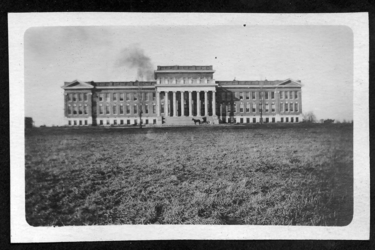 Historic photo showing a horse and buggy parked outside Kirksey Old Main, the first of the five original buildings constructed on what was then Middle Tennessee State Normal School when founded in 1911 and is now Middle Tennessee State University. (MTSU file photo)