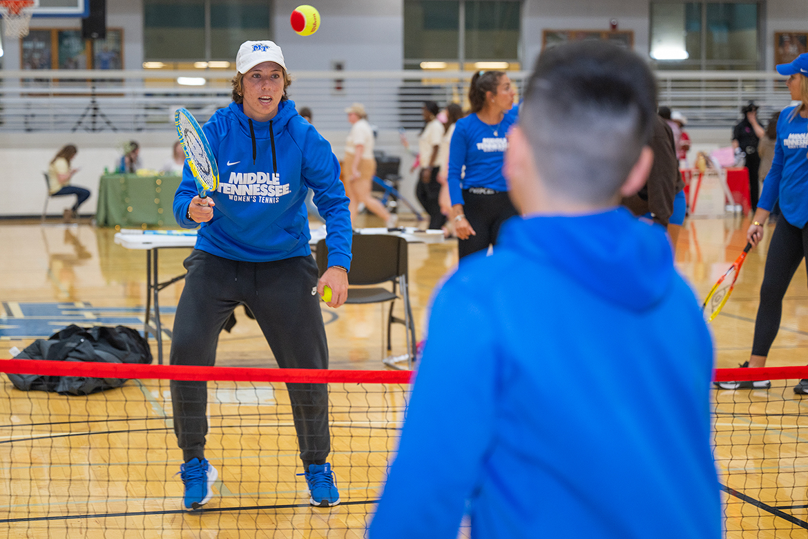 Alessia Truden, left, of Palermo, Italy, returns a shot in a mini tennis game with a participant attending the annual Middle Tennessee State University Relay for Life fundraising event in the Campus Recreation Center gym in Murfreesboro, Tenn. A redshirt senior, Truden is a member of the women’s tennis team that sponsored the March 22 event. (MTSU photo by Cat Curtis Murphy)