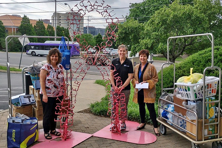 In this file photo, Relay for Life of MTSU and Service Learning Health Promotions class representatives, from left, Dianna Rust and Casie Higginbotham deliver donated items to a representative of the Hope Lodge in Nashville, Tenn. (Photo submitted)
