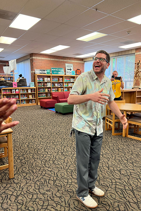 Tony Hartman, Middle Tennessee State University music education alumnus, laughs during a surprise reveal that he had been named among this year’s 30 CMA Foundation’s Music Teachers of Excellence during a celebration put on by his school administrators and students at Scales Elementary School in Murfreesboro, Tenn., in early May 2024. A total of six MTSU alumni won the award this year. (Submitted photo)