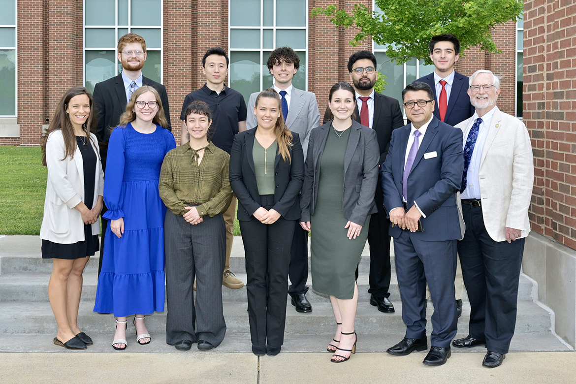 Middle Tennessee State University students participating in the inaugural cohort of the Chair of Excellence in Urban and Regional Planning Scholars Program are shown May 3 outside the Academic Classroom Building on the MTSU campus in Murfreesboro, Tenn., where they concluded this year’s program with the research presentations inside a building classroom. Picture, front row from left, are Andrea Lawrence, COE-URP executive assistant; scholars Anna Collins, Lula Baldriche, Nottely Seagraves and Leah Kimbro; Murat Arik, chairholder; and Paul Martin Jr., chair of the COE-URP advisory committee. Back row, from left, COE-URP graduate assistant Josh Narrell; and scholars Matthew Liu, Elijah Mitchell, Usman Saeed and Nathaniel Harrison. (MTSU photo by Andy Heidt)