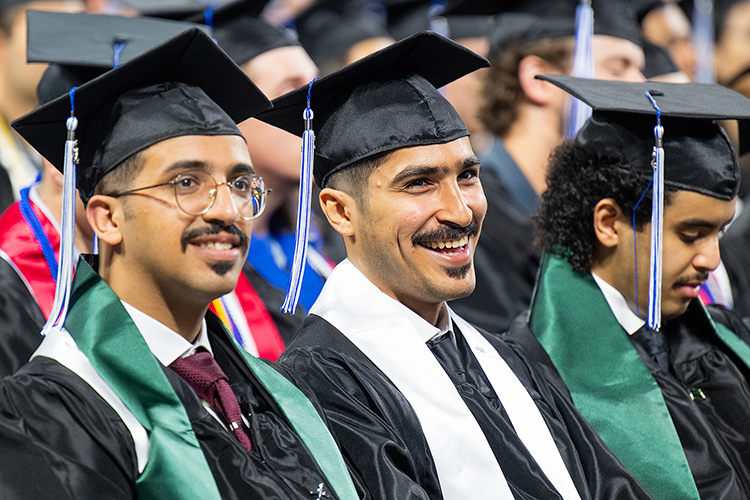 Proud Middle Tennessee State University spring 2024 graduates Abdullah Yousef Alqubayi, left, and Rayan Marzouq Alsalhi prepare to receive their degrees during the Saturday, May 4, morning commencement ceremony for graduates from the College of Basic and Applied Sciences and University College at Murphy Center in Murfreesboro, Tenn. (MTSU photo by Cat Curtis Murphy)