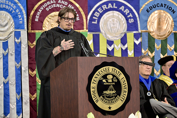 Middle Tennessee State University alumnus and singer-songwriter Michael Hardy, who performs professionally as HARDY, gives keynote remarks at the Saturday, May 4, afternoon spring commencement ceremony at Murphy Center in Murfreesboro, Tenn. It was the last of three ceremonies May 3-4. (MTSU photo by Andy Heidt)