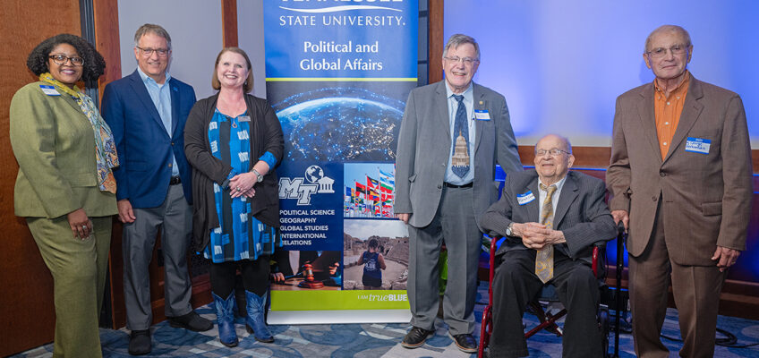 Middle Tennessee State University leaders unveil the new Department of Political and Global Affairs during a Spring Alumni Showcase event held April 9, 2024, at the MT Center on campus in Murfreesboro, Tenn. Pictured, from left, are College of Liberal Arts Dean Leah Lyons; Provost Mark Byrnes; Amy Atchison, political science professor and new Department of Political and Global Affairs chair; Honors College Dean John Vile; David Grubbs, professor emeritus and former Political Science chair; and George Vernardakis, professor emeritus and founder of the George, Cynthia and Roxanne Vernardakis Scholarship. (MTSU photo by Cat Curtis Murphy)