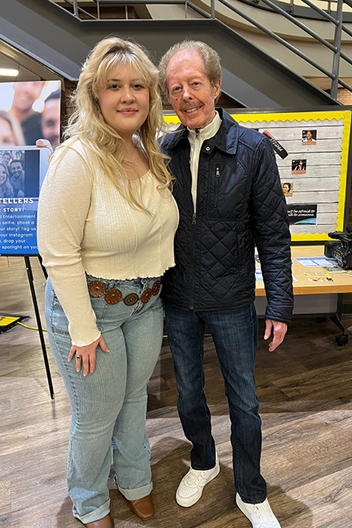 Middle Tennessee State University School of Journalism and Strategic Media alumna and current graduate student Karli Sutton, left, and musician Kenny Lovelace, right, pose for a photo in the John Bragg Media and Entertainment Building in Murfreesboro, Tenn., after an interview. (Submitted photo)