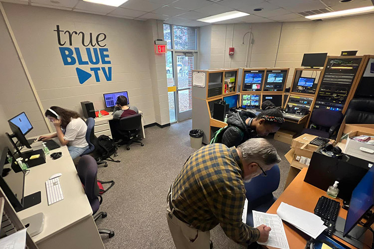 Ty Whitaker, front right, assists student workers in the True Blue TV control room inside Middle Tennessee State University’s McWherter Learning Resource Center on the MTSU campus in Murfreesboro, Tenn. (MTSU submitted photo)