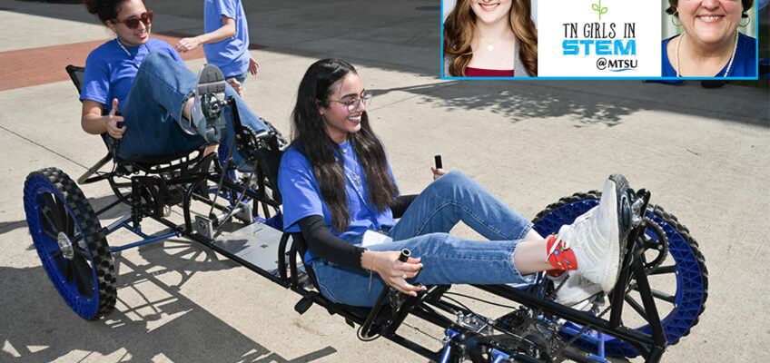 Girls navigate a lunar rover on the sidewalk near the Middle Tennessee State University Science Building on the MTSU campus in Murfreesboro, Tenn., in September 2023, as Lily Hardin of Nashville, Tenn., an MTSU graduate and former graduated student with the Engineering Technology Experimental Vehicles Program, assists. More than 100 middle school and high school girls will be attending this year’s Tennessee Girls in STEM event Saturday, Oct. 19. (MTSU file photo by James Cessna)